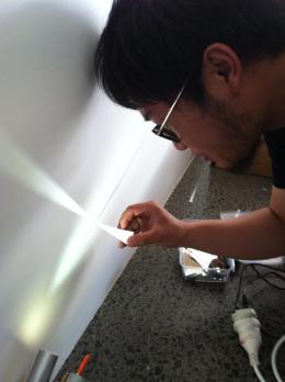 Alvin Xiong installing at Corner; photo courtesy of the artist