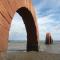 Andy Goldsworthy Arches 2005, pink leadhill sandstone blocks stacked into 11 freestanding arches each arch 7m long photo by Rob Garrett
