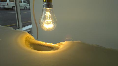 Chelsea Rothbart, Wax workings-Slouch (day 2), 2012, wax, light bulb, electric cable and steel (0337), photo by Rob Garrett