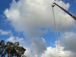 Installing Gary Smith's Really High!? 2012, NZ Sculpture OnShore 2012; photo by Rob Garrett