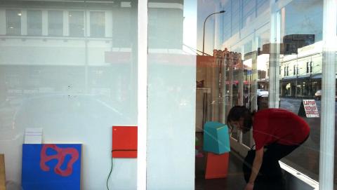 Jenny Horrell installing Untitled Flux, 2013, Corner project space; photo by Rob Garrett