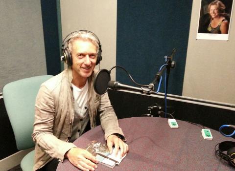 Rob Garrett in the recording booth at Radio NZ; photo courtesy of Rob Garrett