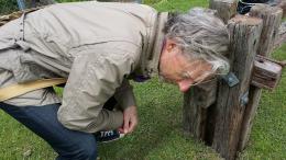 Rob Garrett listening to Sharonagh Montrose's sound project at NZ Sculpture OnShore 2014; photo courtesy of Rob Garrett