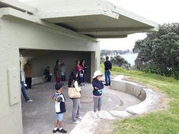Visitors listening to Sharonagh Montrose's My Small Corner at NZ Sculpture OnShore