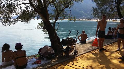 Visitors to Christo and Jeanne-Claude's The Floating Piers,  on the shore of Monte Isola, Lake Iseo, Italy; photo by Rob Garrett